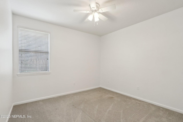 empty room with light carpet, ceiling fan, and baseboards