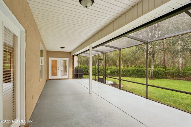 unfurnished sunroom featuring french doors