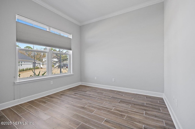 unfurnished room featuring ornamental molding and plenty of natural light