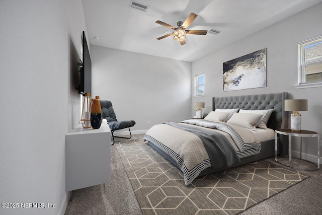 bedroom featuring multiple windows, carpet floors, and ceiling fan