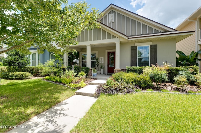 view of front of home featuring a porch and a front yard