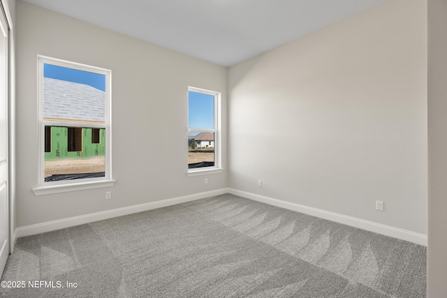 unfurnished room with carpet floors