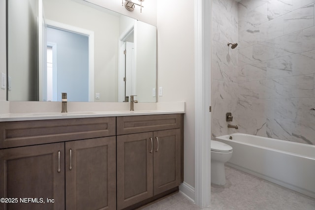 full bathroom with vanity, tiled shower / bath combo, and toilet