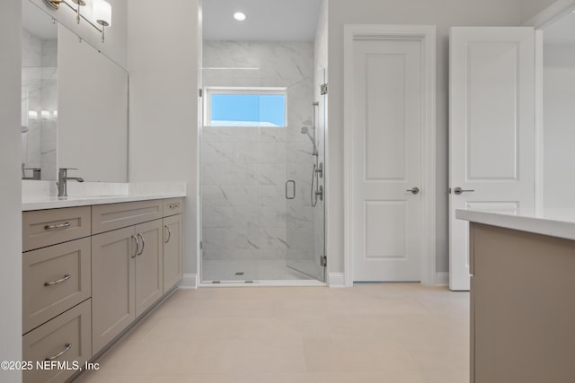 bathroom with vanity, tile patterned flooring, and a shower with shower door