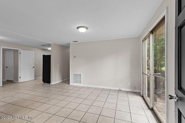 view of tiled spare room