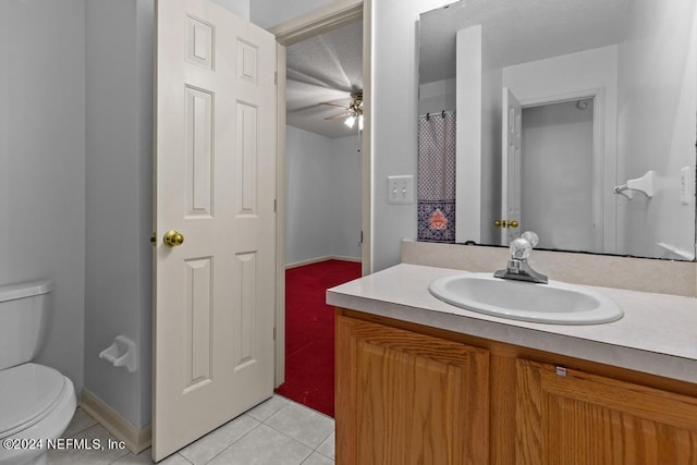 bathroom with vanity, ceiling fan, tile patterned floors, and toilet