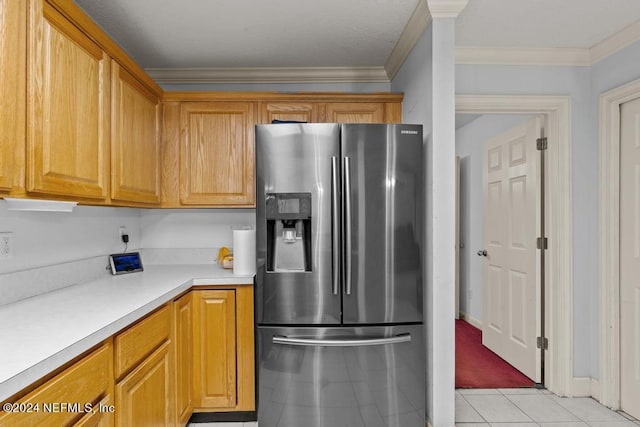 kitchen featuring crown molding, stainless steel fridge with ice dispenser, and light tile patterned floors