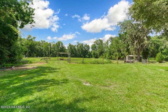 view of yard with a rural view