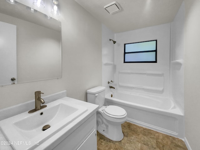 full bathroom featuring toilet, vanity, and washtub / shower combination