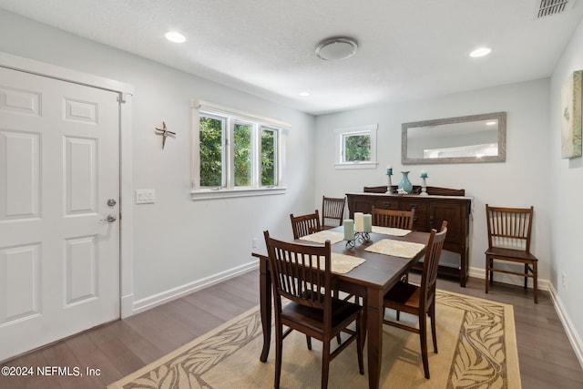 dining area with dark wood-type flooring