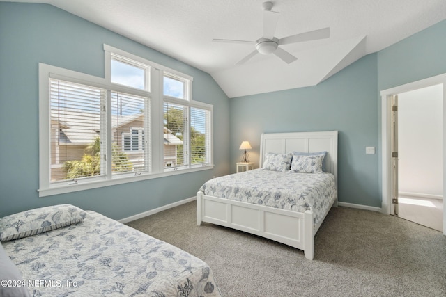 carpeted bedroom featuring vaulted ceiling and ceiling fan