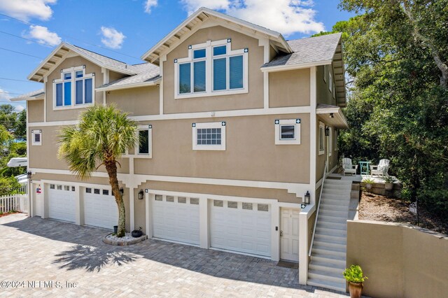 view of front of property with a garage