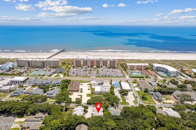 birds eye view of property featuring a water view and a view of the beach