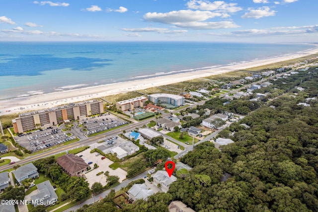 bird's eye view featuring a view of the beach and a water view