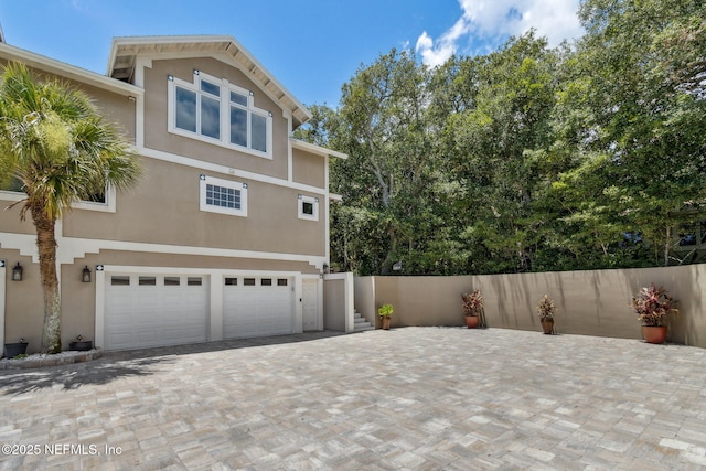 view of side of home featuring a garage