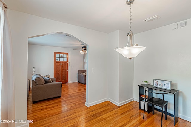 interior space featuring ceiling fan and wood-type flooring