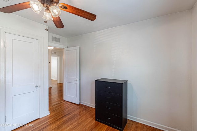 unfurnished bedroom featuring ceiling fan and hardwood / wood-style floors