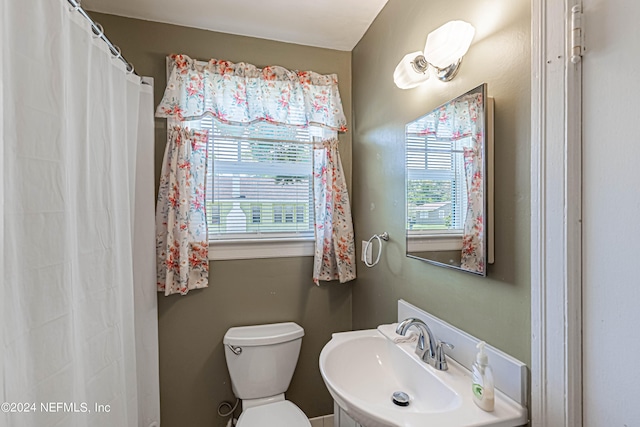 bathroom featuring sink and toilet