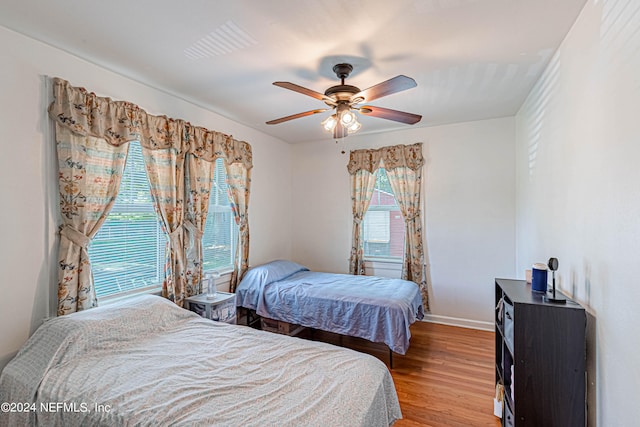 bedroom featuring wood-type flooring and ceiling fan