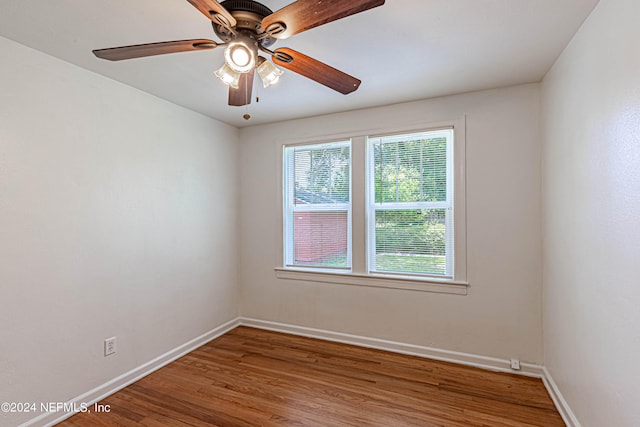 empty room featuring hardwood / wood-style flooring and ceiling fan