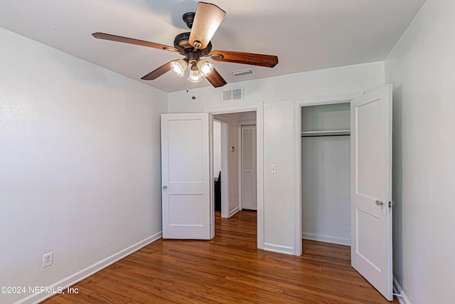 unfurnished bedroom with wood-type flooring and ceiling fan