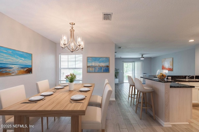 8550 Argyle Business Loop Unit 1507, Jacksonville, FL 32244 - dining room with light wood finished floors, baseboards, visible vents, and a chandelier