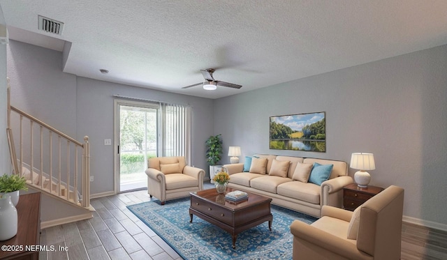 8550 Argyle Business Loop Unit 1507, Jacksonville, FL 32244 - living room with baseboards, stairs, visible vents, and wood finished floors