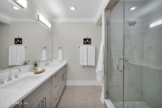 bathroom featuring a shower with door, tile patterned flooring, vanity, and ornamental molding