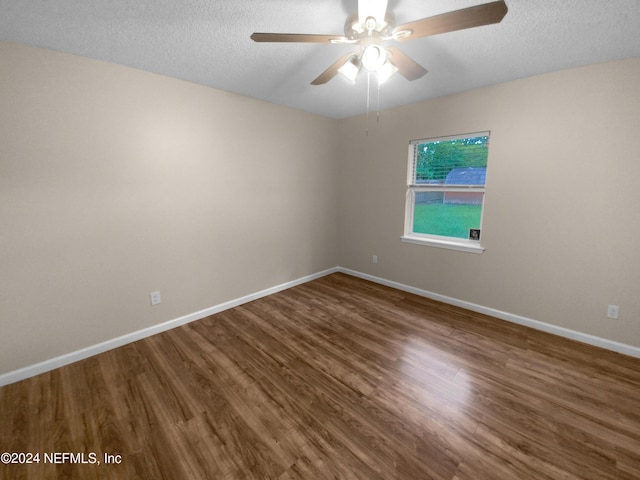 spare room with wood-type flooring, a textured ceiling, and ceiling fan