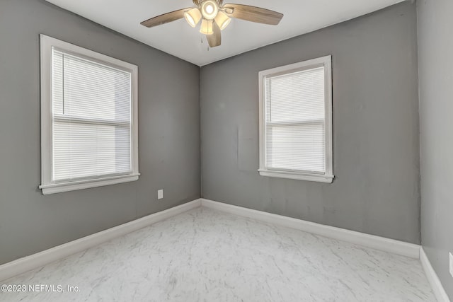 unfurnished room featuring ceiling fan