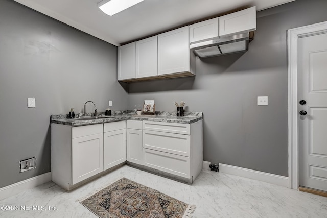 kitchen with sink and white cabinets