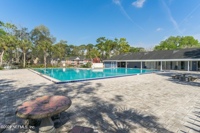 view of swimming pool featuring a patio