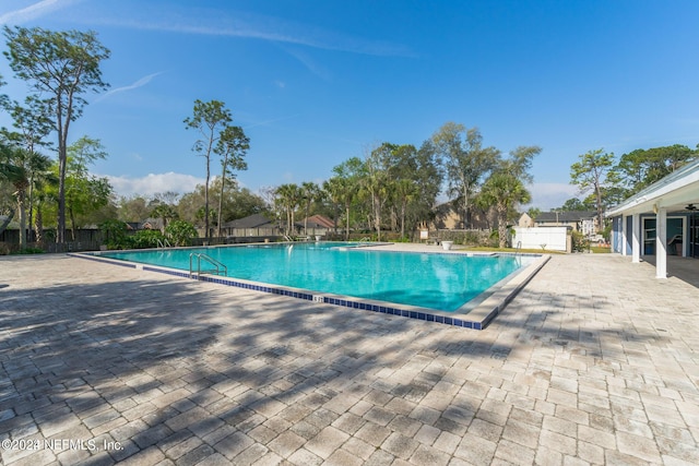 view of swimming pool with a patio area