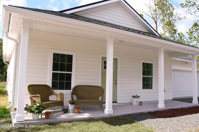 exterior space with a garage and a porch