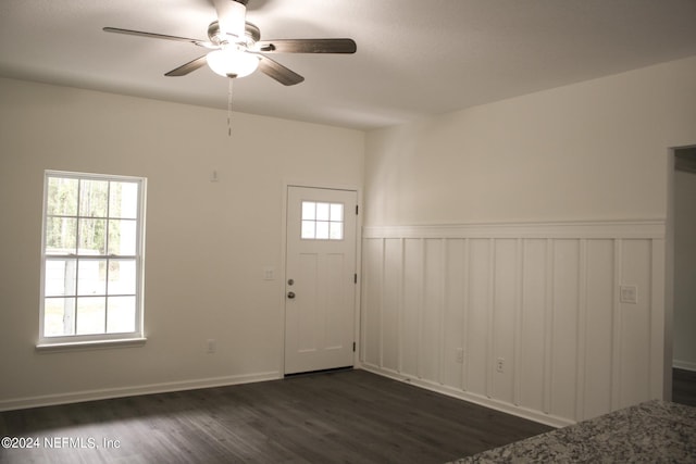 foyer with ceiling fan and dark hardwood / wood-style flooring