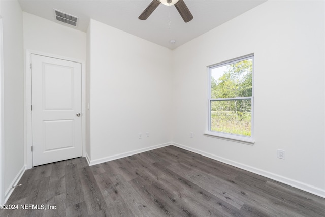 unfurnished room with ceiling fan and dark hardwood / wood-style floors