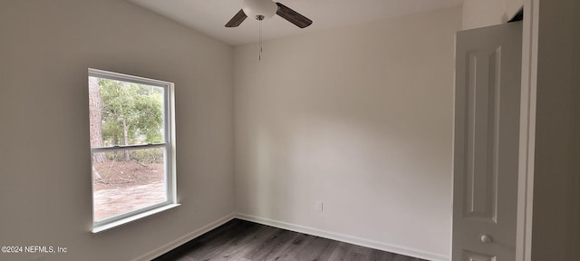 unfurnished room featuring ceiling fan and dark hardwood / wood-style floors