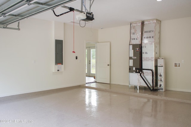 garage with electric panel and a garage door opener