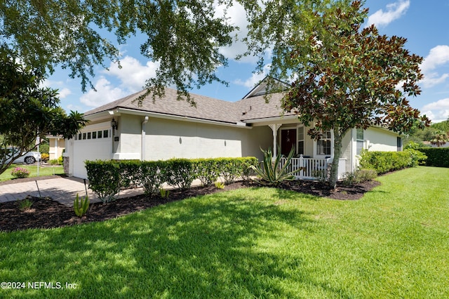 ranch-style house with stucco siding, a porch, concrete driveway, a garage, and a front lawn