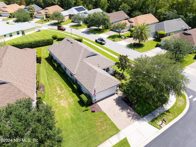 birds eye view of property with a residential view