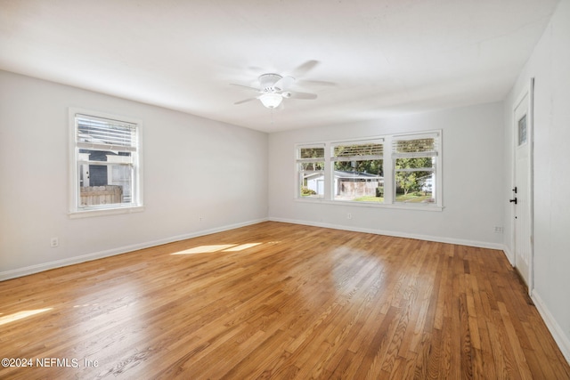 spare room with light hardwood / wood-style flooring and ceiling fan