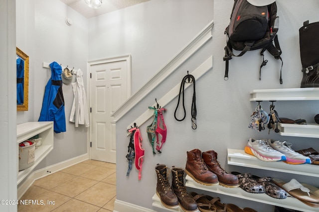 spacious closet featuring light tile patterned floors