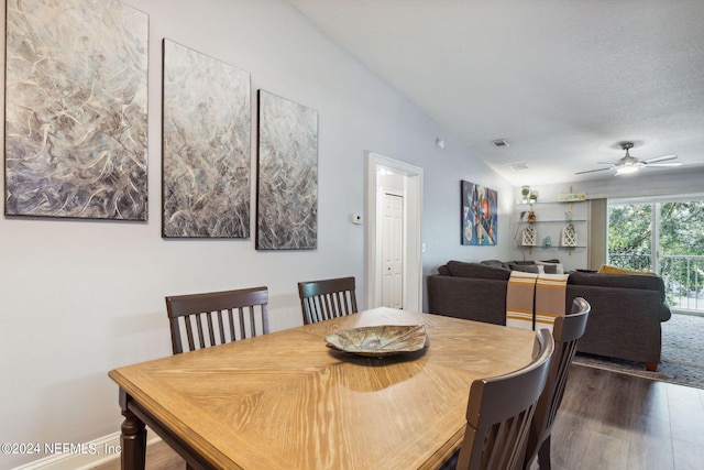 dining space with dark wood-type flooring, a textured ceiling, and ceiling fan