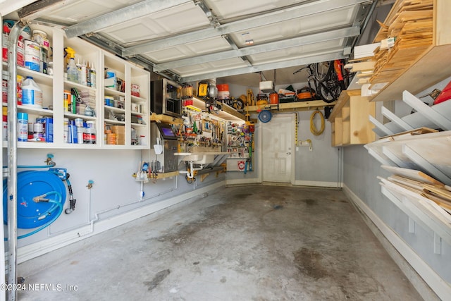 garage featuring sink and a workshop area