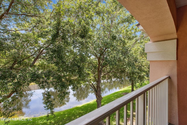 balcony featuring a water view