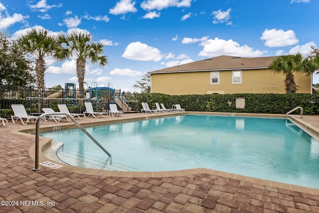 view of swimming pool featuring a patio