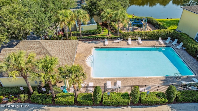 view of swimming pool with a water view