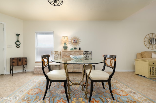 dining space with light tile patterned floors