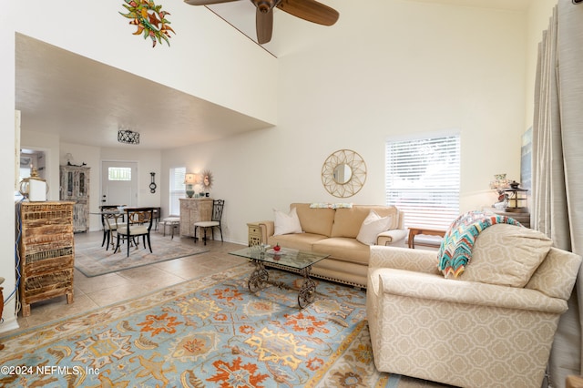 tiled living room with ceiling fan