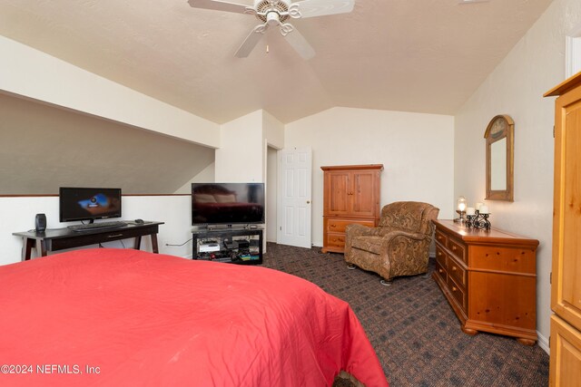 carpeted bedroom with lofted ceiling and ceiling fan